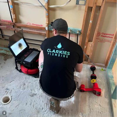 Clarkies Plumbing plumber inspecting a drain with a CCTV camera